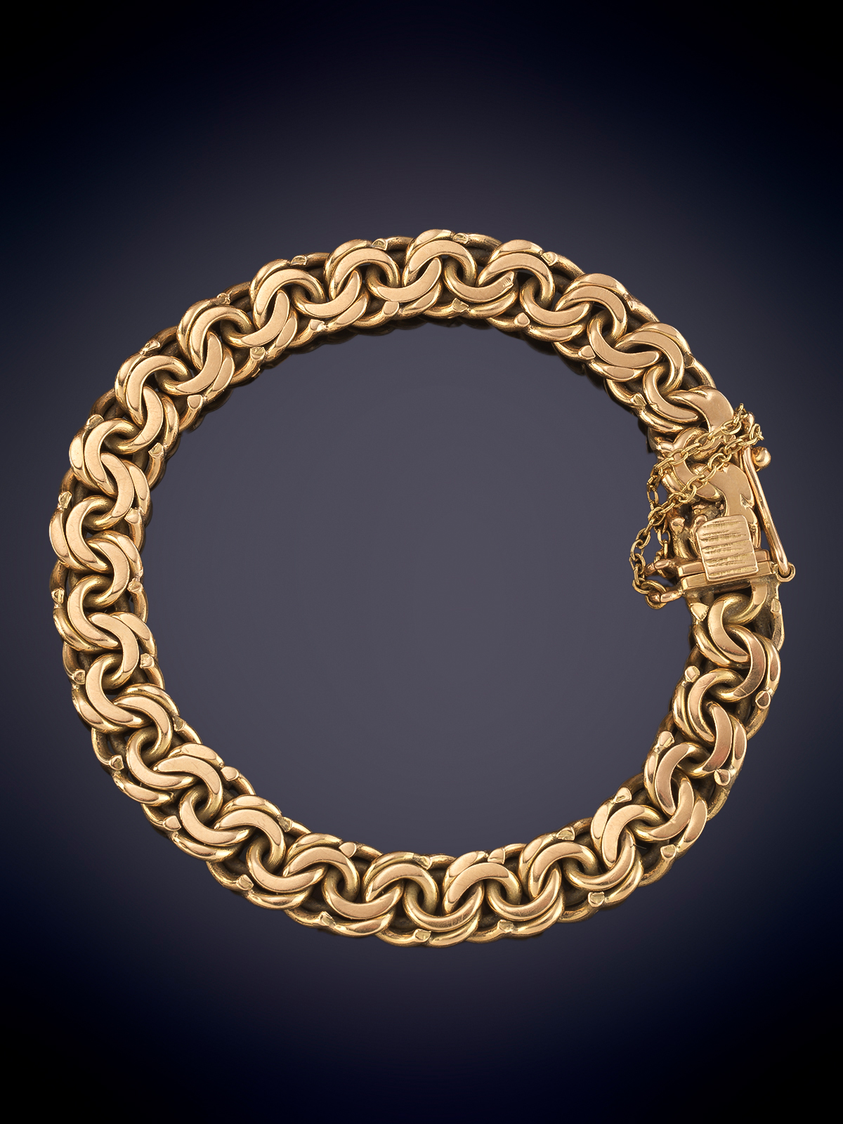 PULSERA DE ESLABON BARBADO EN ORO AMARILLO DE 18k.