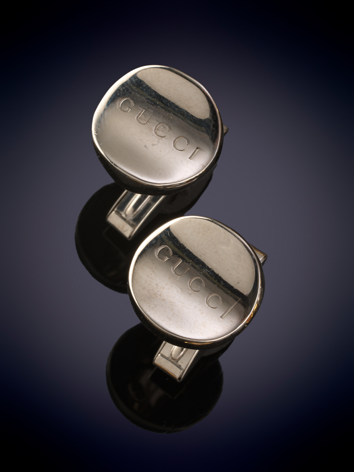GUCCI. GEMELOS DE PLATA DE LEY.