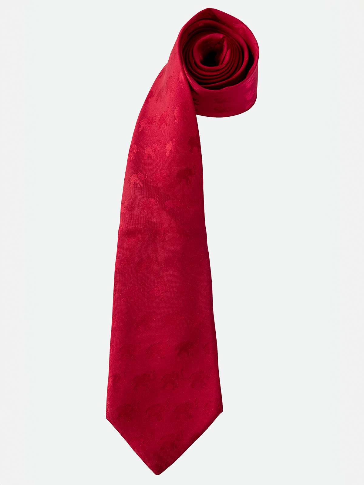 HERMÉS. CORBATA EN TONO ROJO CON DETALLES DE ELEFANTES EN BRILLO.