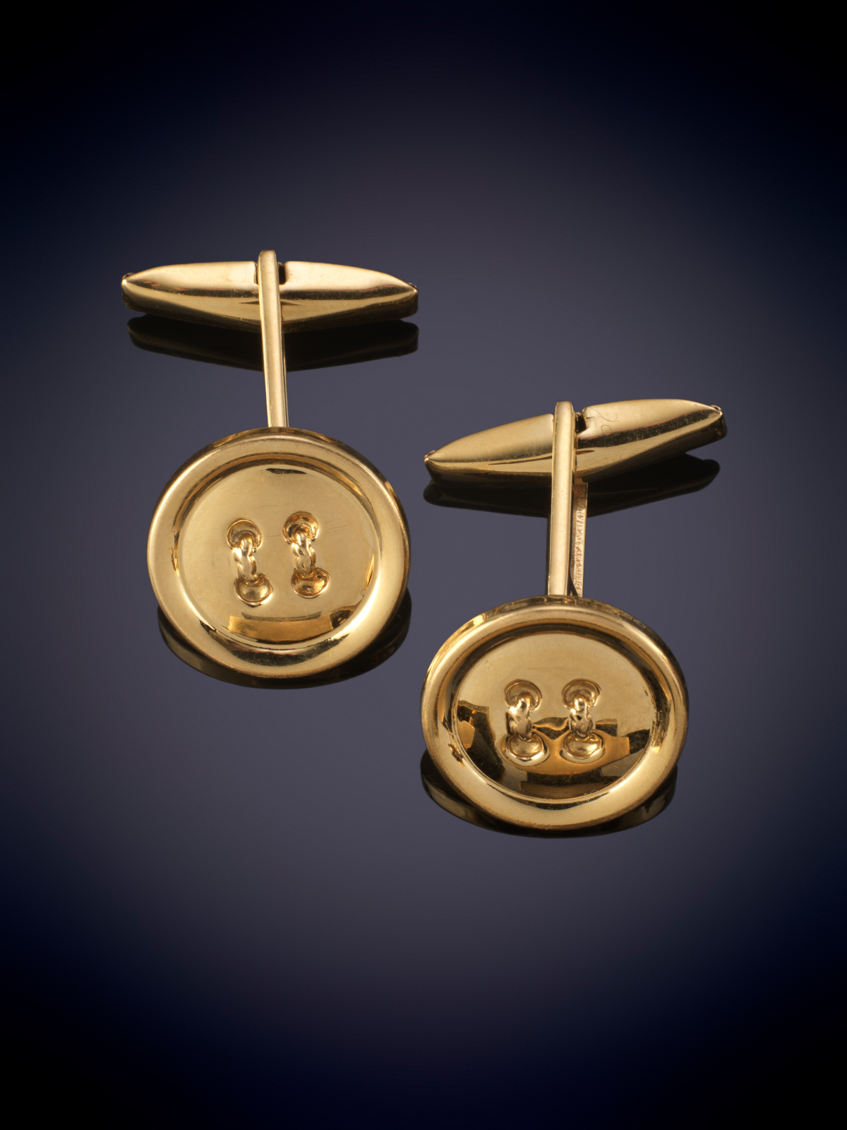 GEMELOS EN FORMA DE BOTON DE ORO AMARILLO DE 18K.