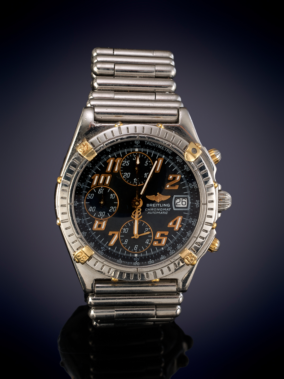 BREITLING CHRONOMAT. RELOJ DE PULSERA PARA CABALLERO EN ACERO Y ORO. ESFERA AZUL CON NUMERACIÓN...