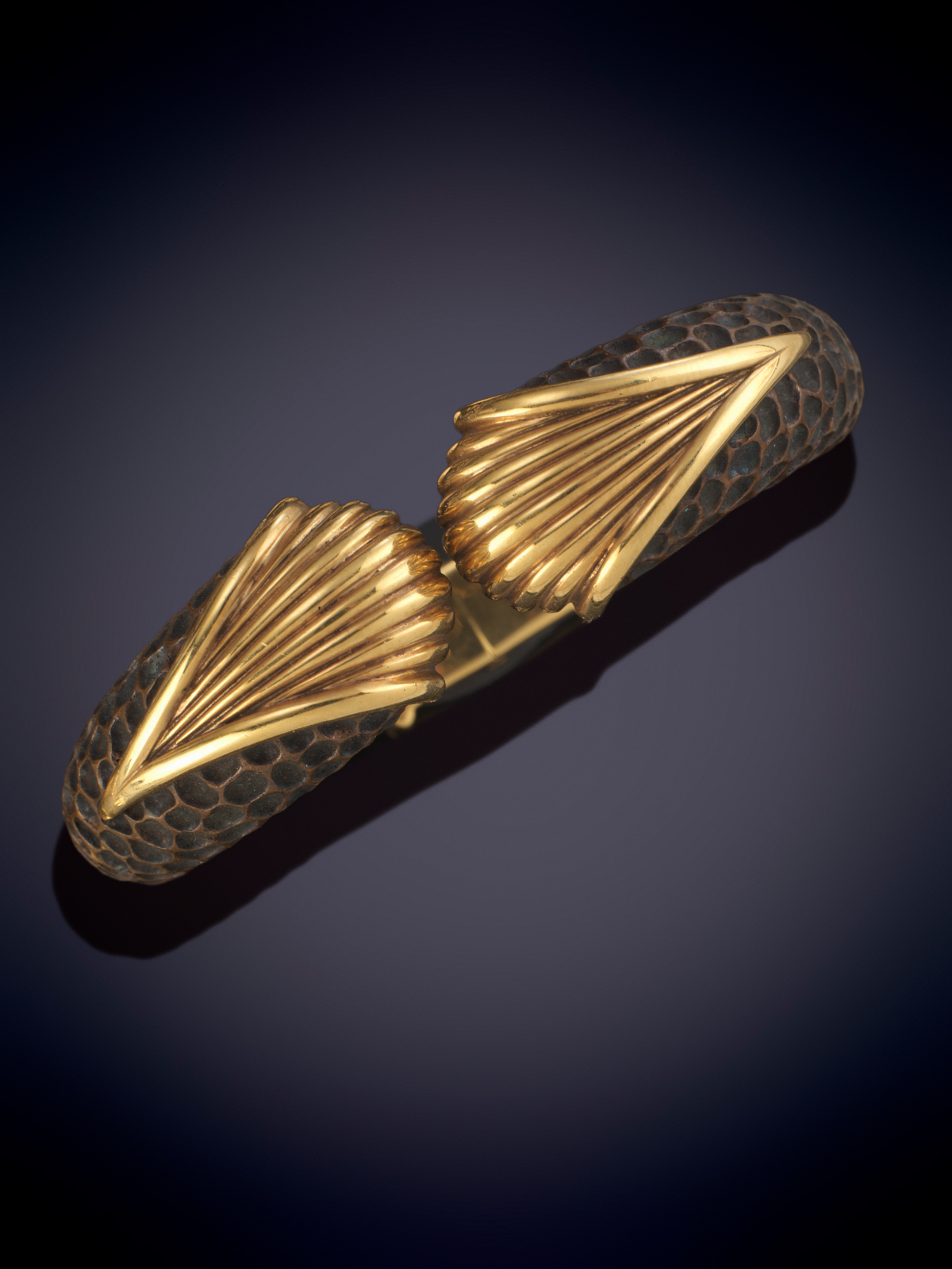 GREGORY. BRAZALETE RIGIDO DE COBRE Y ORO AMARILLO DE 18K. GRAN DISEÑO AÑOS 70.